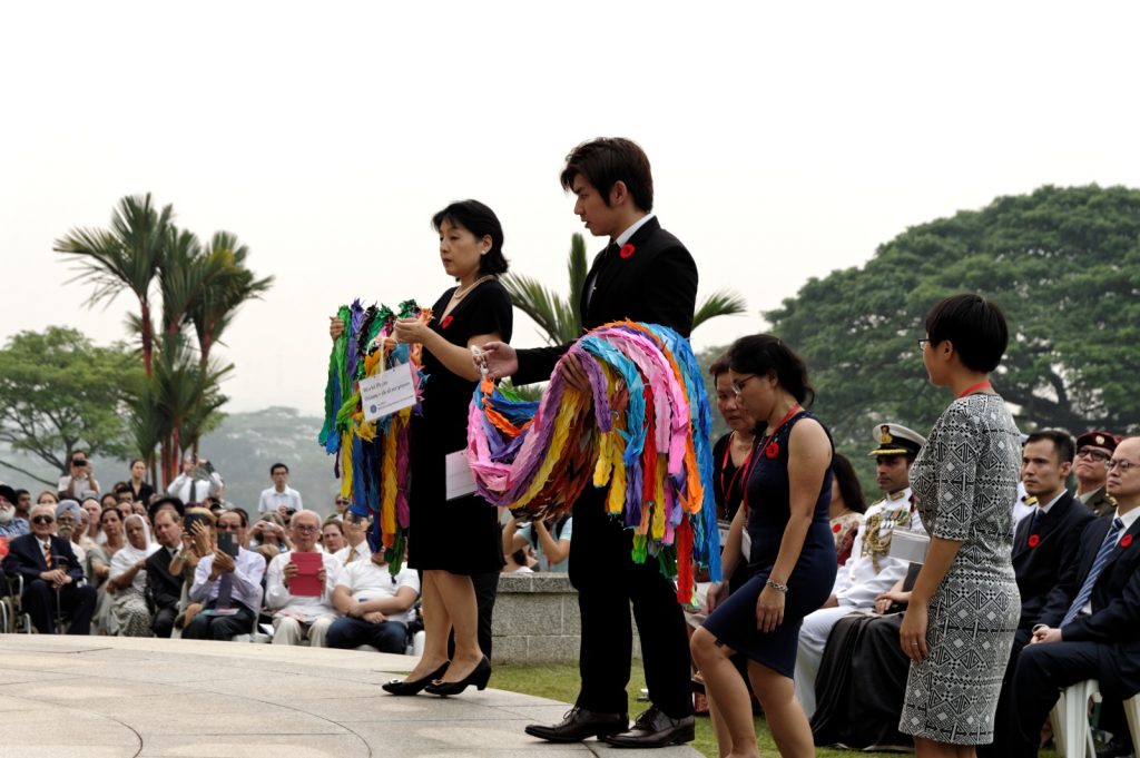 Representatives from the Japanese community in Singapore, laying tsurus - origami paper cranes symbolic of peace, at Kranji War Cemetery in 2015.